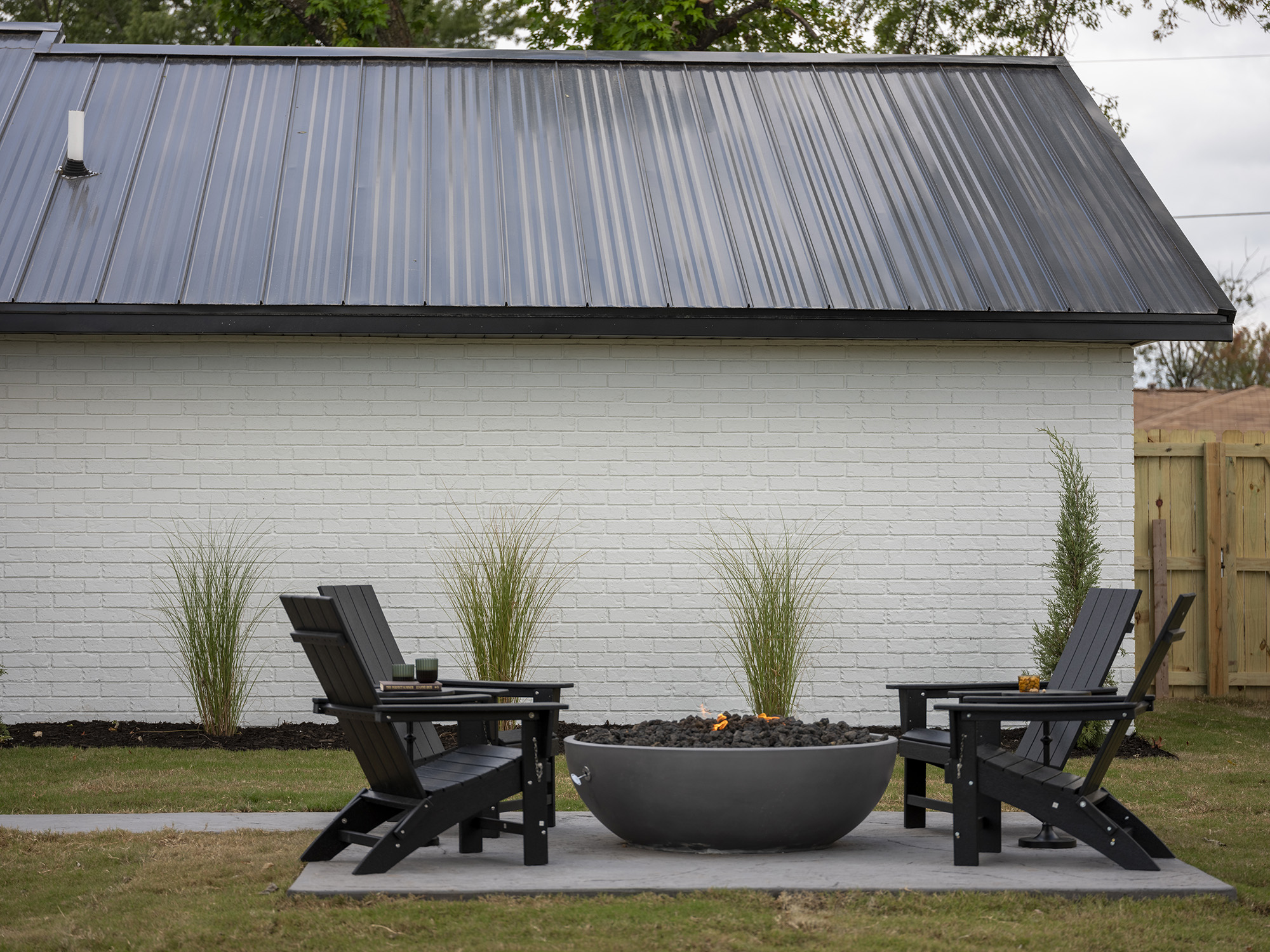 modern ranch home renovation featuring black metal roofing from Fortify Building Solutions™