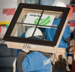 Builder Carrying a Ply Gem New Construction Window
