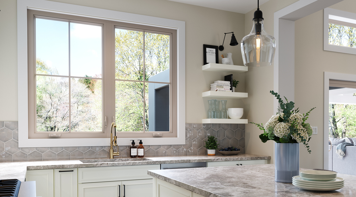 Tan casement window over the kitchen sink with a multi-point lock.